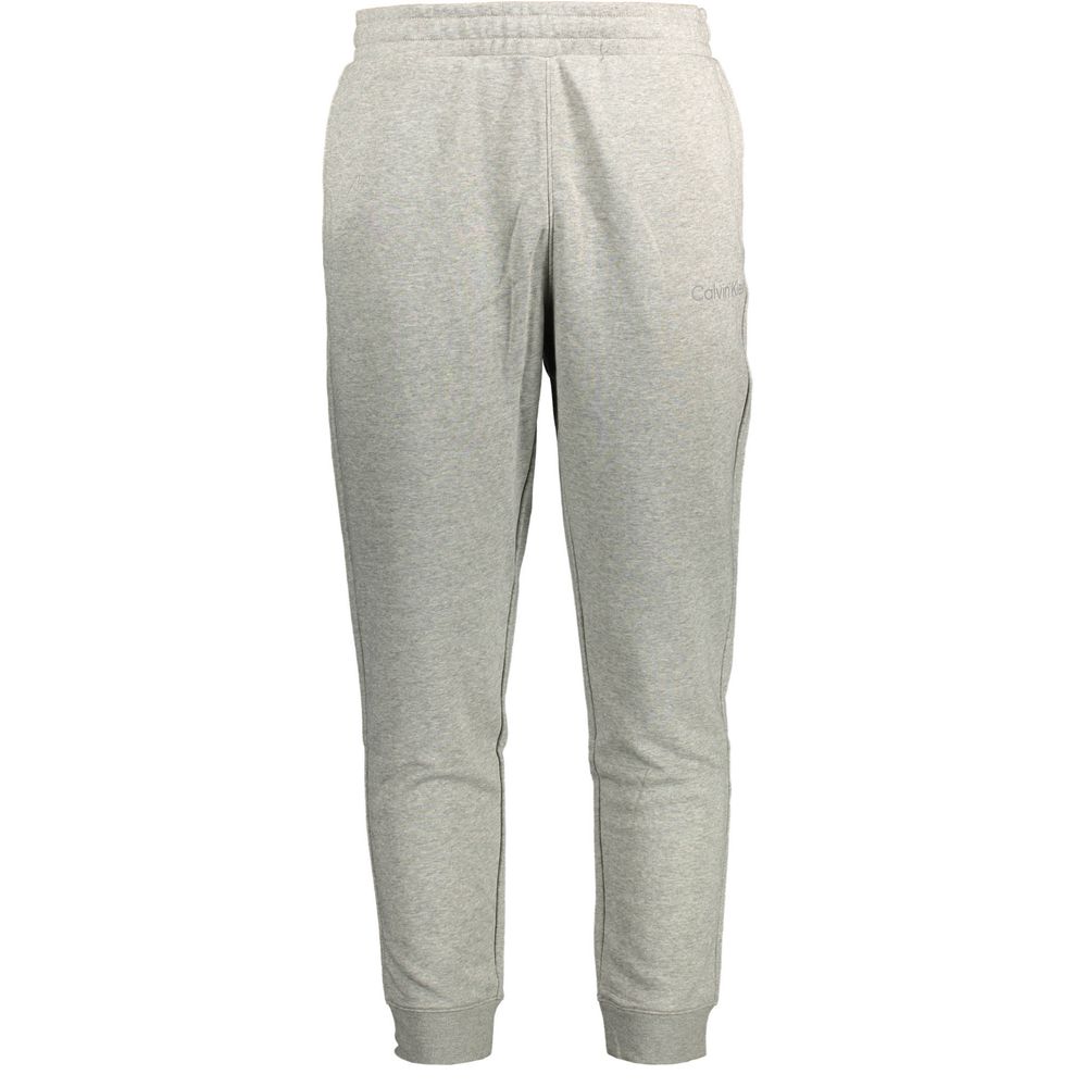 Pantalon de survêtement pour homme Calvin Klein gris en coton, style décontracté avec taille élastique et poches.