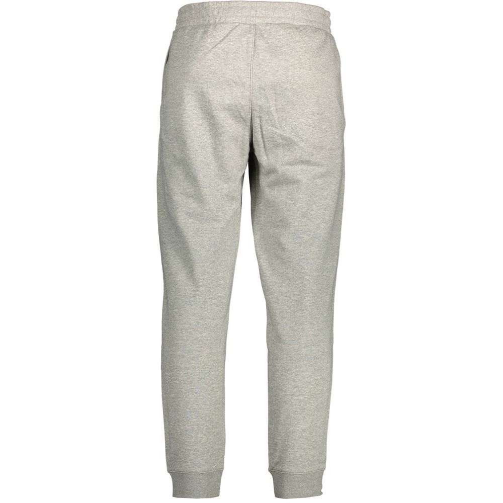 Pantalon de jogging gris en coton pour homme de la marque Calvin Klein, vue de face avec détails de la taille et des poches