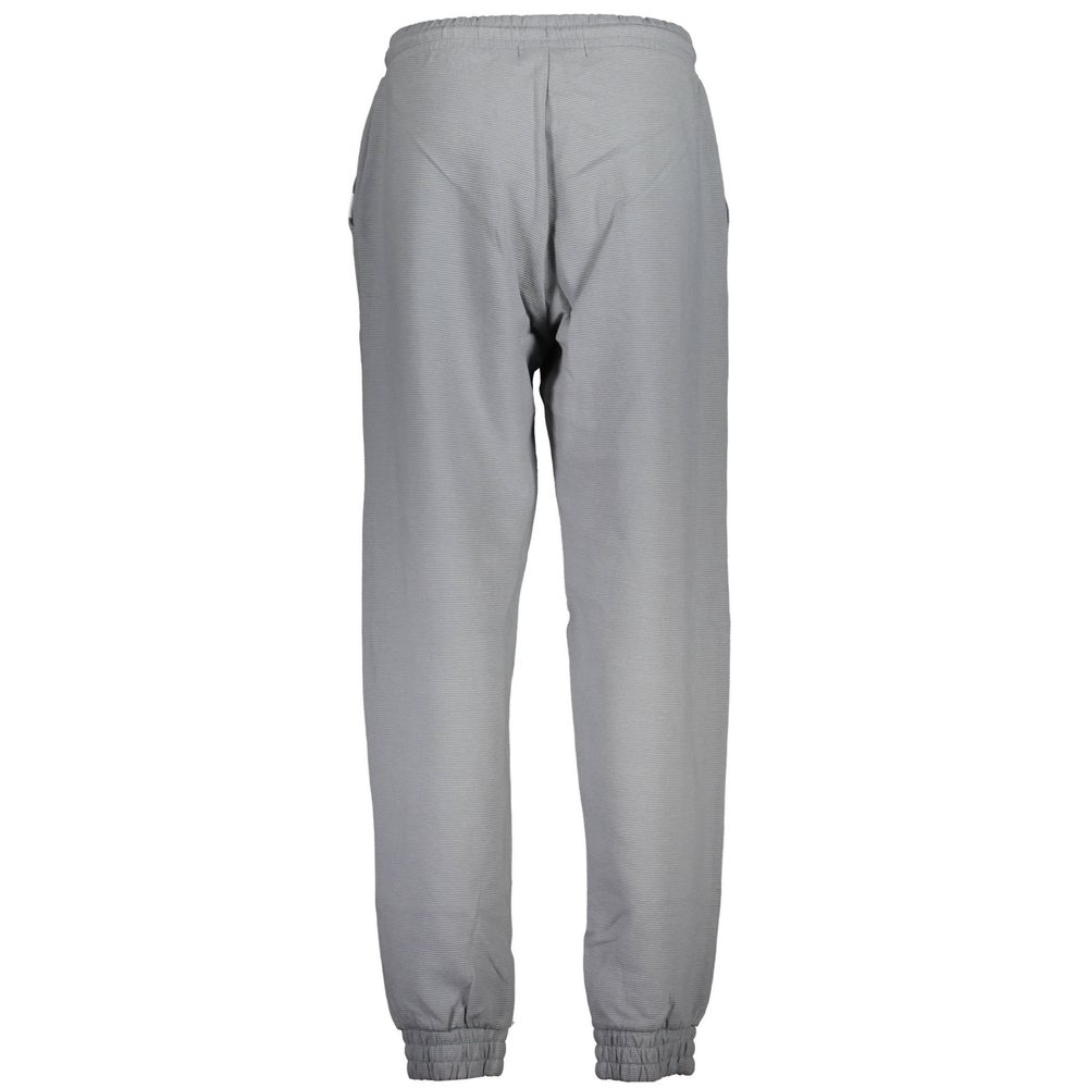 Pantalon de jogging pour femmes Calvin Klein en coton gris, style décontracté avec logo Calvin Klein visible.