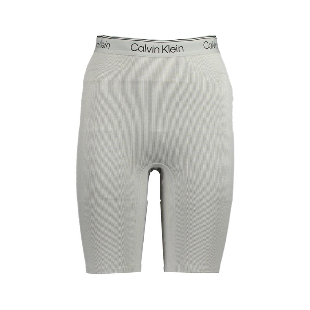 Pantalon de survêtement en polyester gris pour femme de la marque Calvin Klein, confort et style décontracté.