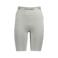 Pantalon de survêtement en polyester gris pour femme de la marque Calvin Klein, confort et style décontracté.