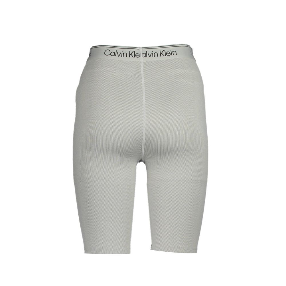Pantalon de survêtement gris en polyester pour femme de la marque Calvin Klein, doux et confortable.
