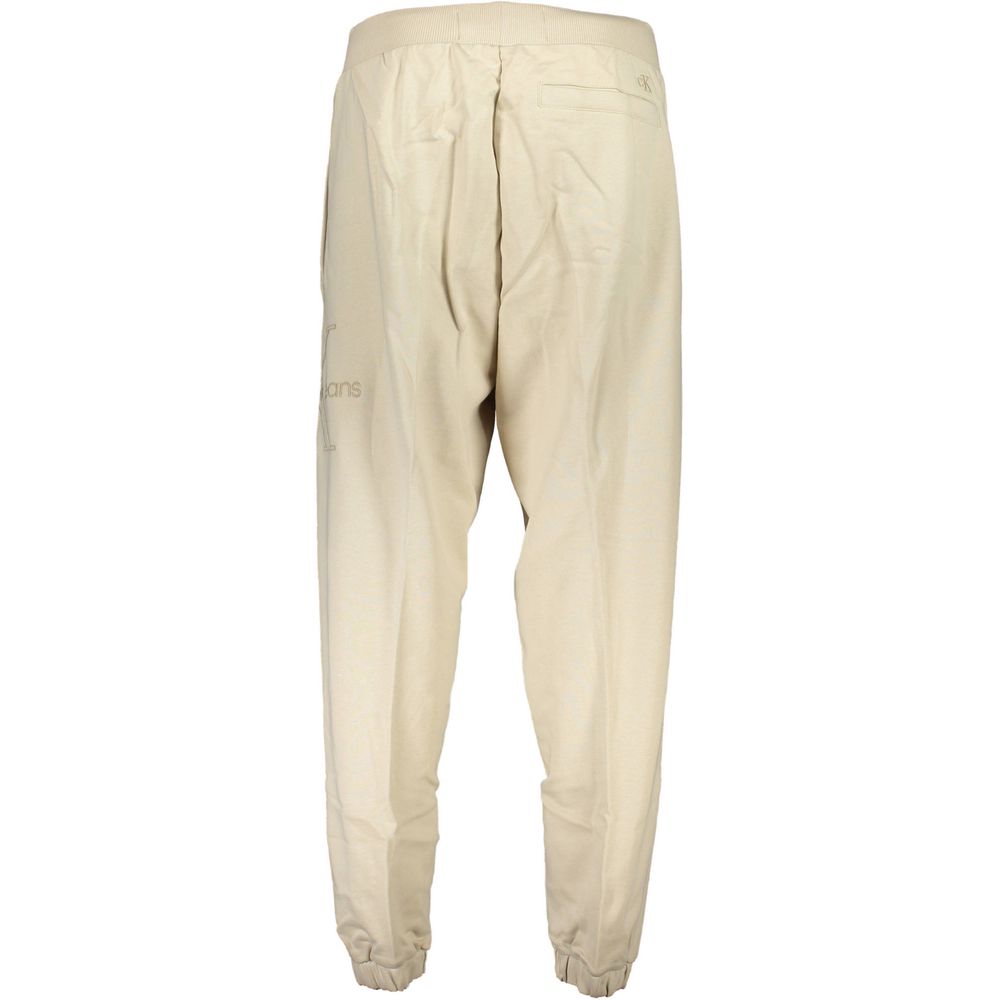 Pantalon de survêtement beige en coton pour homme de la marque Calvin Klein, vue de face.