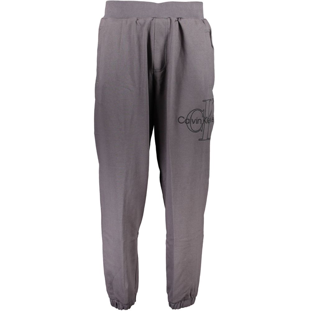Pantalon de sweat en coton gris pour homme de la marque Calvin Klein, vue de face avec détails du tissu.