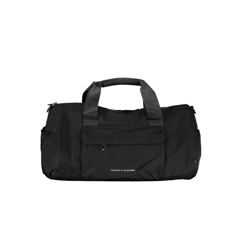 Sacoche homme Tommy Hilfiger en polyester noir avec poche frontale et bandoulière, vue de face.