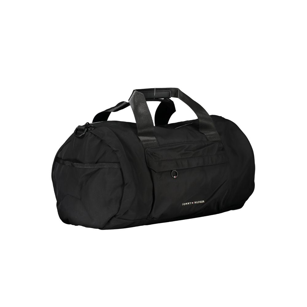 Sacoche homme Tommy Hilfiger en polyester noir, bandoulière réglable, design élégant et pratique pour un usage quotidien.