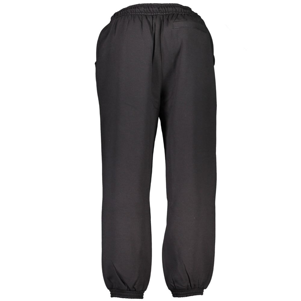 Pantalon de survêtement noir en coton pour homme de la marque Calvin Klein, vue de face.