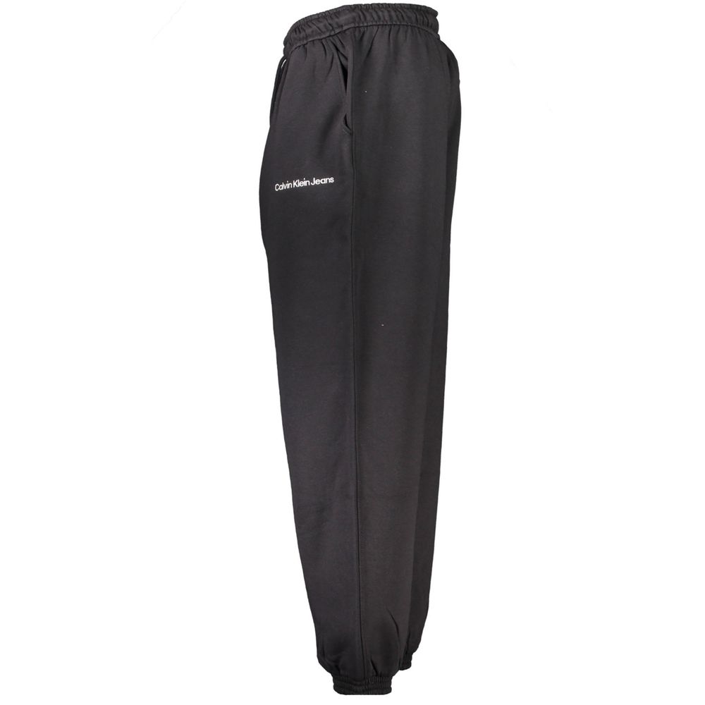 Pantalon de sweat en coton noir pour homme de la marque Calvin Klein, vue de face avec détails du tissu et de la coupe.