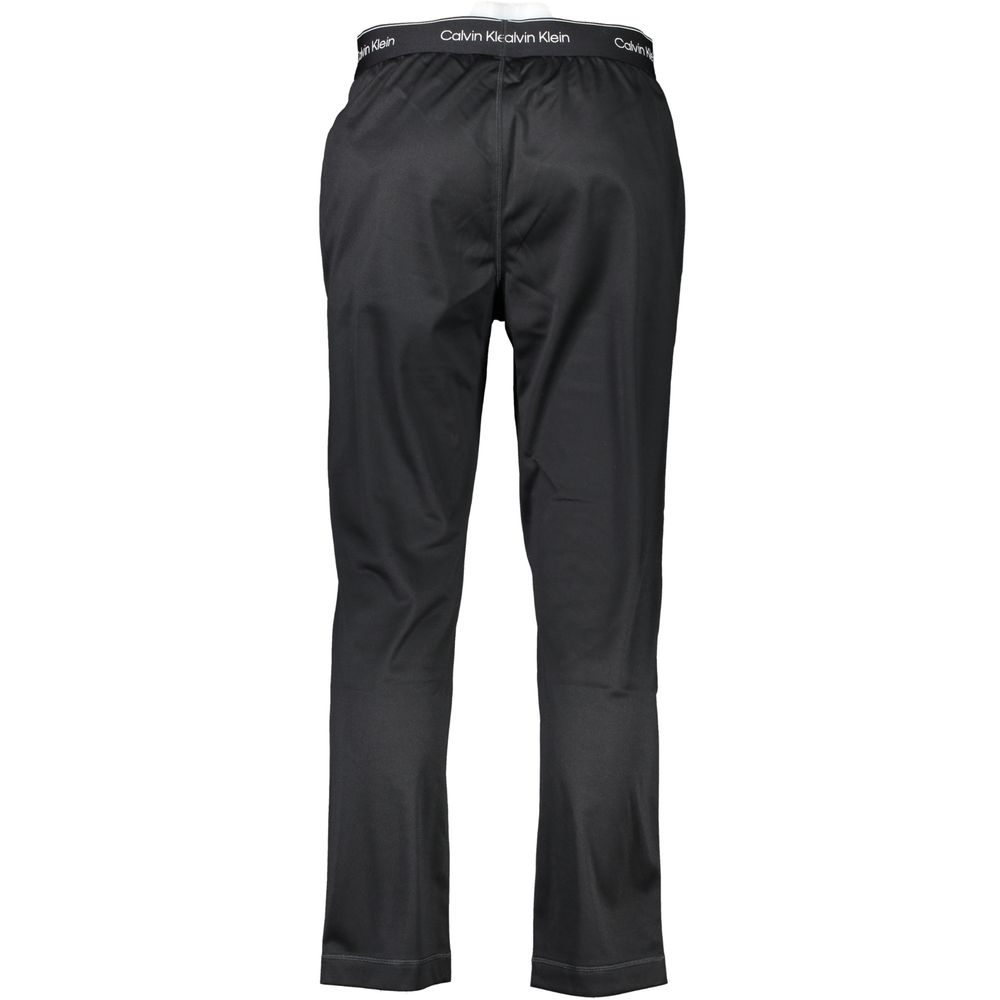 Pantalon de sport pour homme Calvin Klein en polyester noir, coupe décontractée et taille élastiquée.