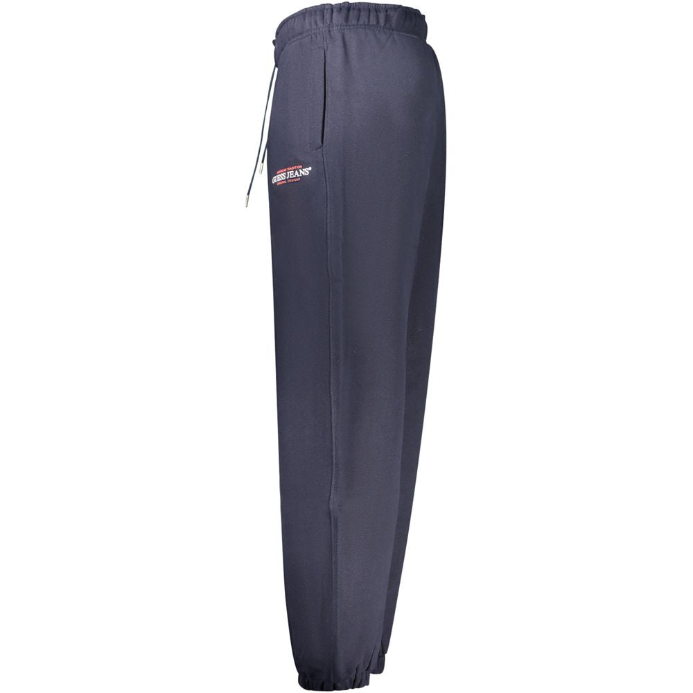 Pantalon de jogging bleu en coton pour homme de Guess Jeans, style décontracté avec ceinture élastique et poches latérales.