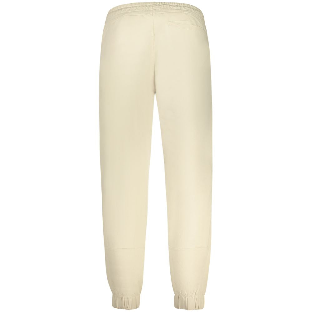 Pantalon de survêtement beige en coton pour homme de la marque Guess Jeans, affiché sur un mannequin.