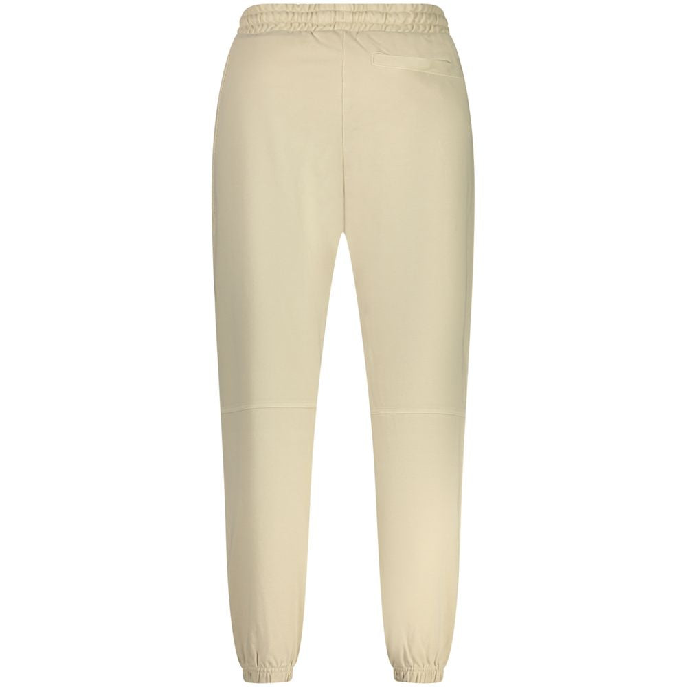 Pantalon de sport beige pour homme en coton de la marque Hugo Boss, ajusté et confortable pour le sport ou la détente.