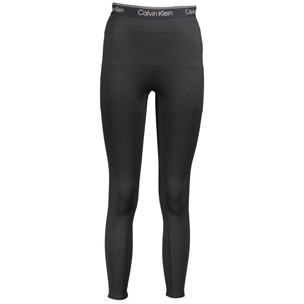 Leggings pour femmes en polyester noir de la marque Calvin Klein, vêtement ajusté et confortable pour le sport ou la casual.
