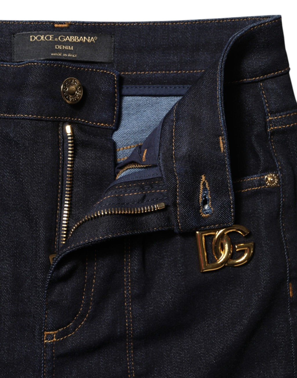 Jeans skinny en denim coton bleu à taille haute de Dolce & Gabbana, visible avec fermeture éclair et poches avant.