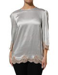 Haut Dolce & Gabbana en soie satin gris avec dentelle florale à manches longues, élégant et sophistiqué.