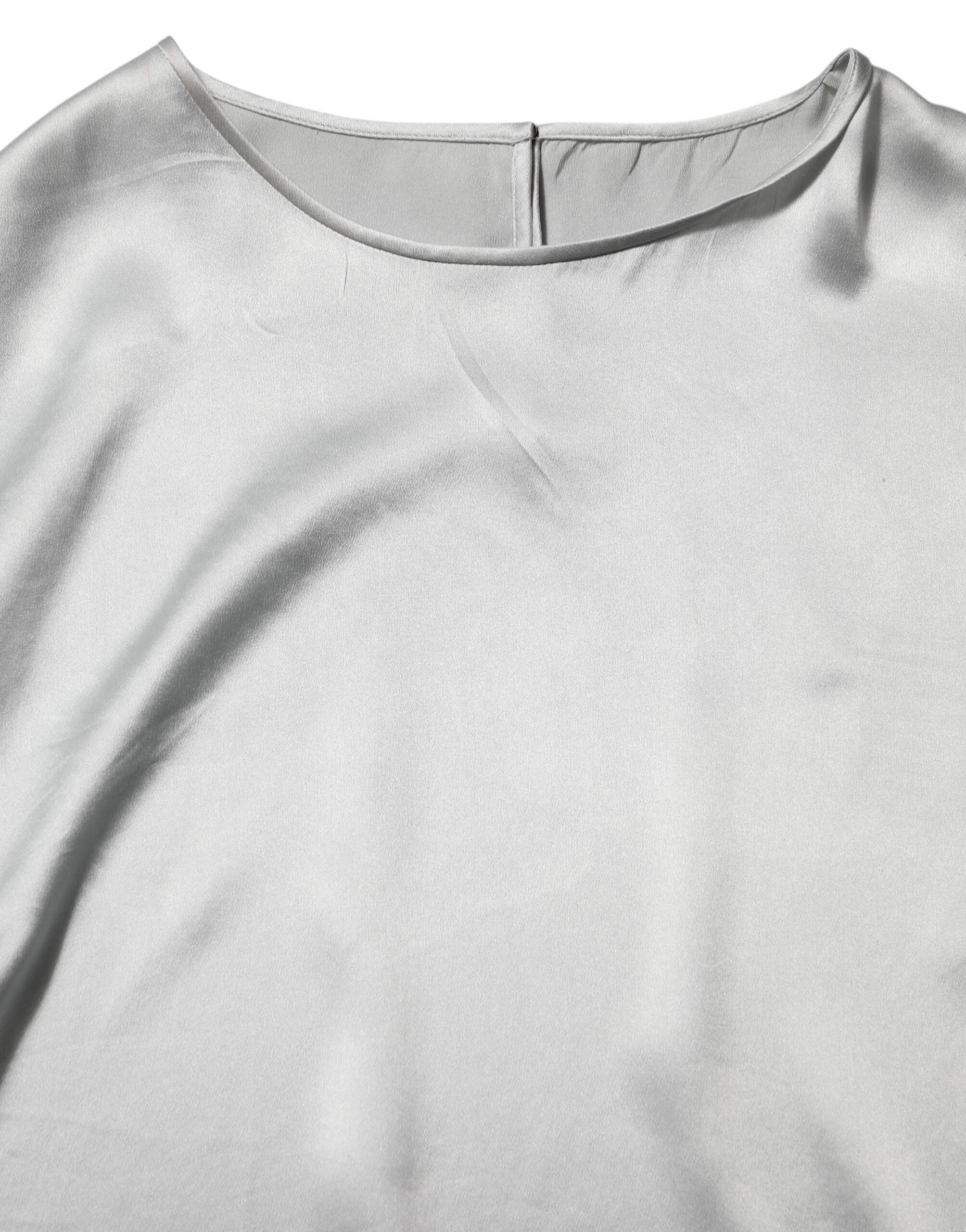 Chemise Dolce & Gabbana en soie grise satinée avec broderies florales et manches longues, élégante et raffinée.