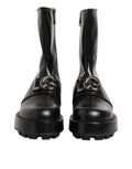 Bottes biker mi-mollet noires Dolce & Gabbana avec plaque logo, style robuste et élégance moderne visible sur l'image.