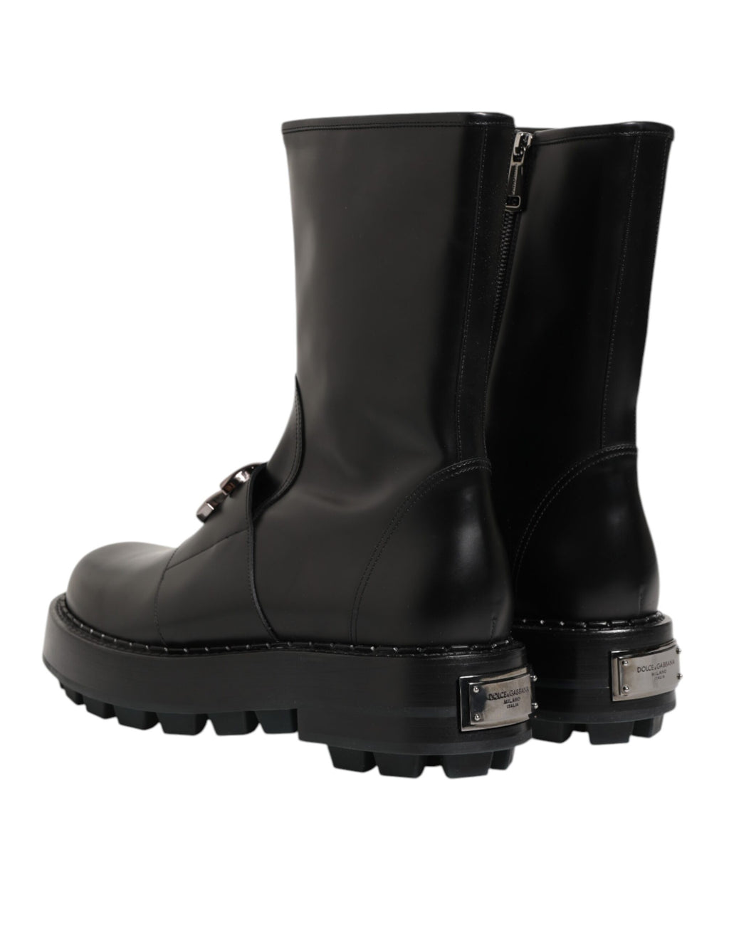 Bottes biker Dolce & Gabbana noires avec plaque logo, mi-mollet, en cuir, style robuste et élégant.