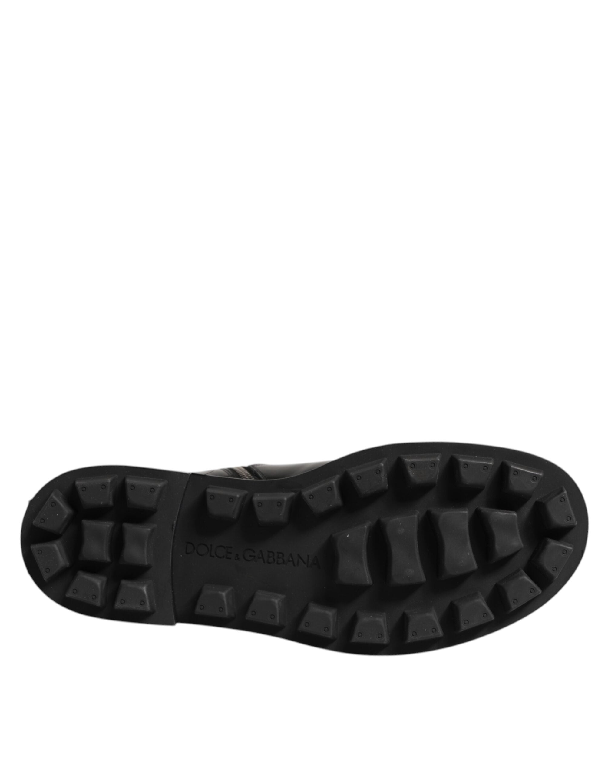 Bottes biker mi-mollet noires Dolce & Gabbana avec plaque logo, style robuste et détails en cuir pour un look audacieux.