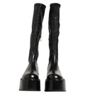 Bottes hautes Dolce & Gabbana noires avec plaque logo, style over the calf, en cuir élégant et tendance.