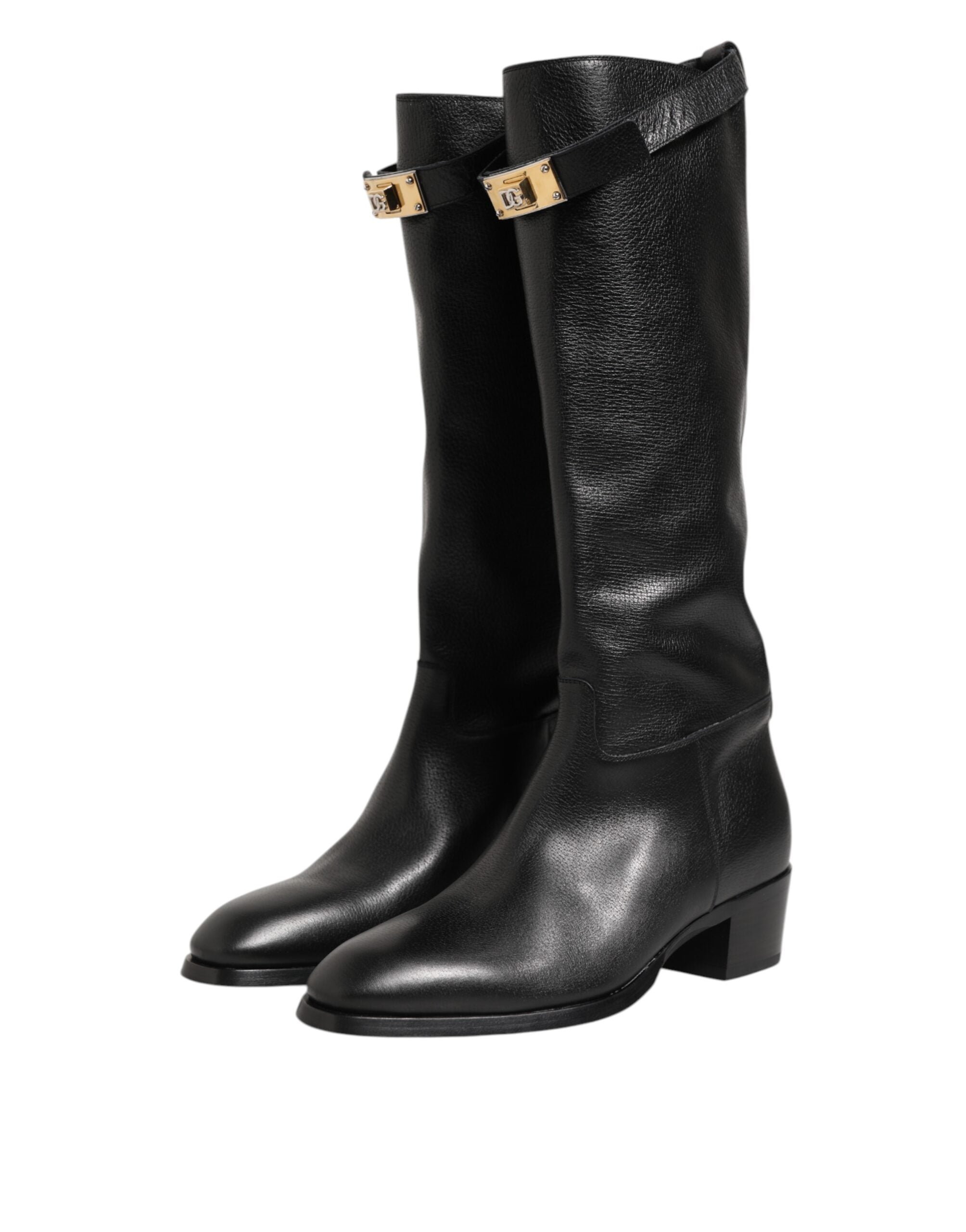 Chaussures Dolce & Gabbana noires avec plaque logo, bottines over-the-calf en cuir, style élégant et sophistiqué.