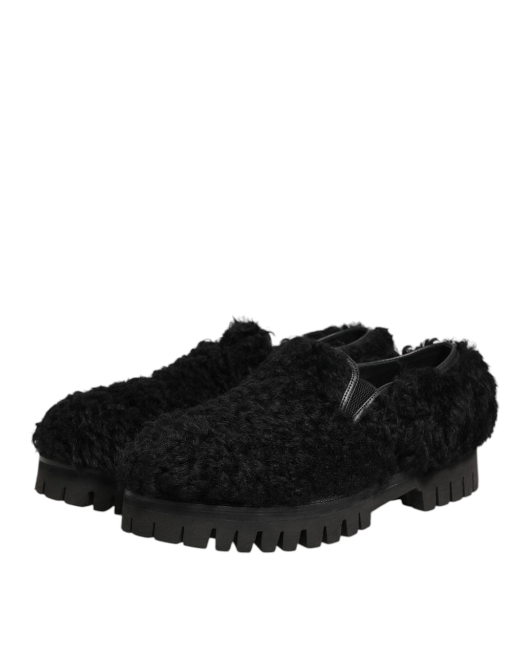 Chaussures pour hommes Dolce & Gabbana, slippers noires en fourrure et cuir, élégantes et sophistiquées.