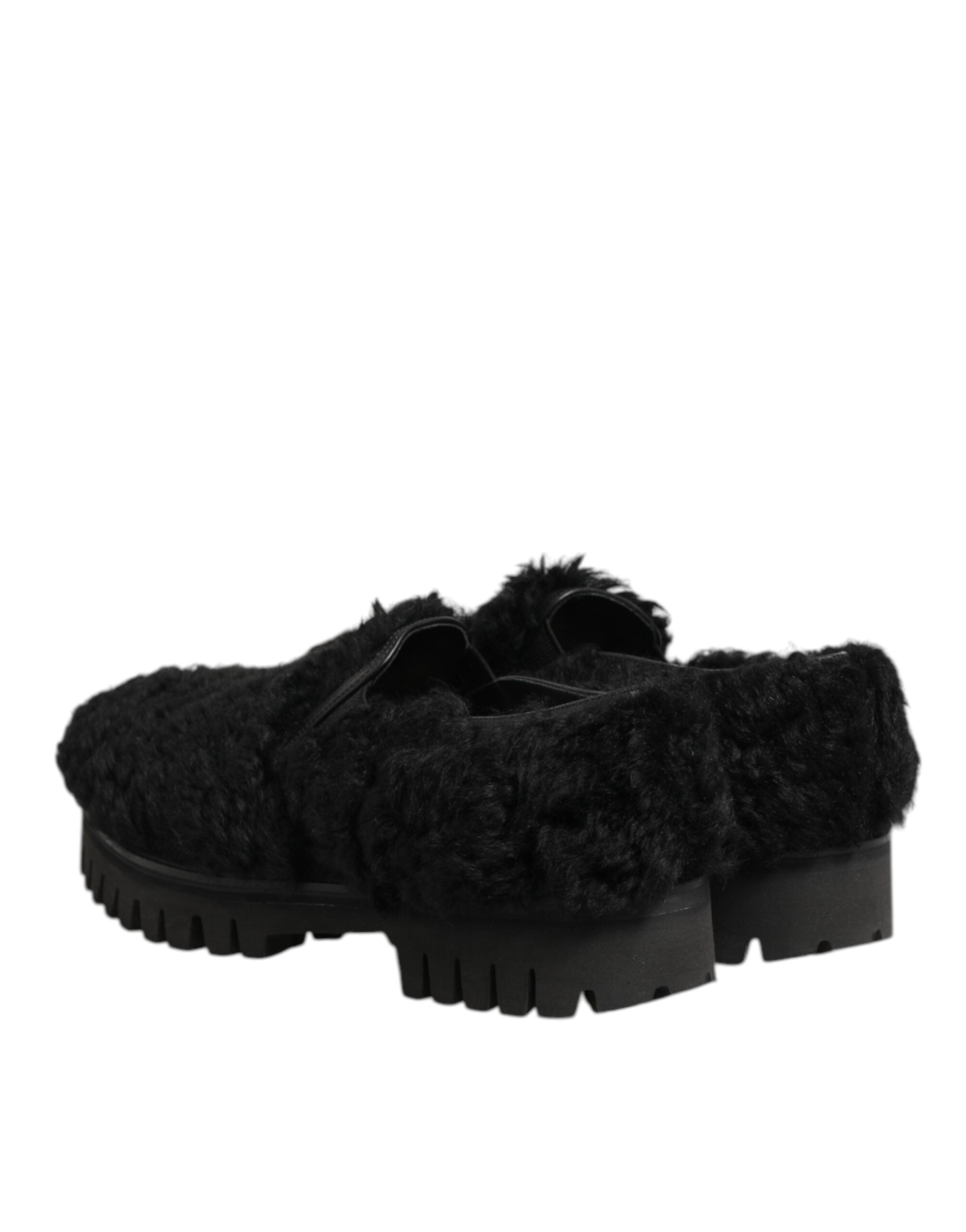 Chaussures Dolce & Gabbana pour hommes, slippers en cuir noir avec détails en fourrure, style élégant et luxe.
