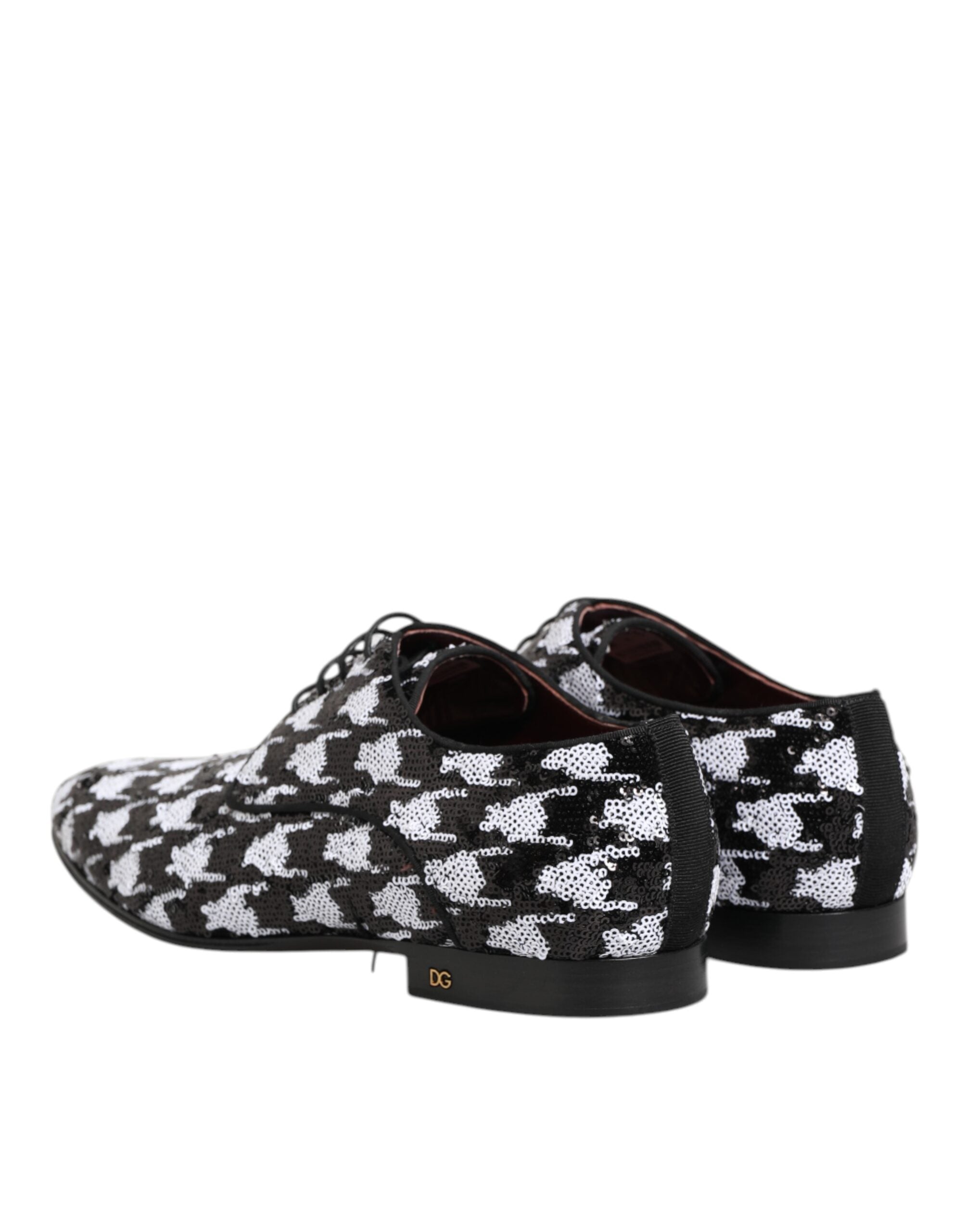 Chaussures Derby Dolce & Gabbana noires et blanches avec sequins et laçage, élégantes et brillantes.