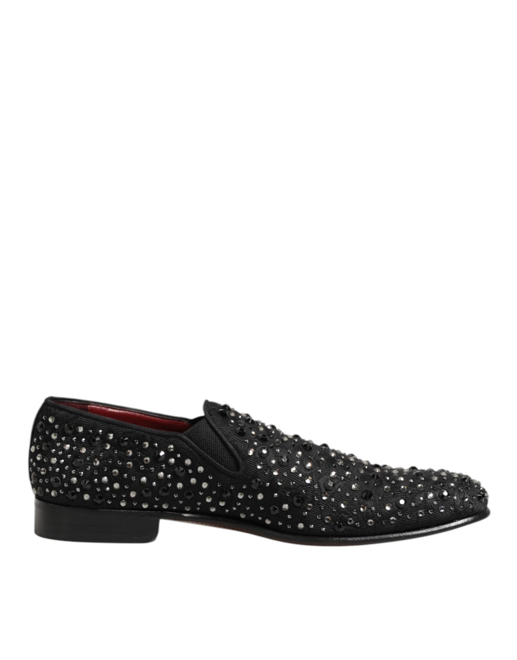 Chaussures loafers en daim noir de Dolce & Gabbana ornées de cristaux, vue de face sur fond blanc.