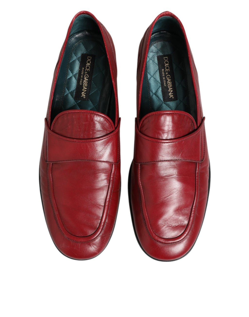 Chaussures mocassins en cuir rouge Dolce & Gabbana pour homme, style slip-on élégant et confortable.