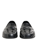Chaussures Dolce & Gabbana, baskets basses en caoutchouc noir, sneakers modernes avec semelle plate et design épuré.