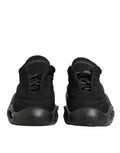 Chaussures sneakers basses Dolce & Gabbana pour homme en dentelle noire avec laçage en forme de vague, vue de face.