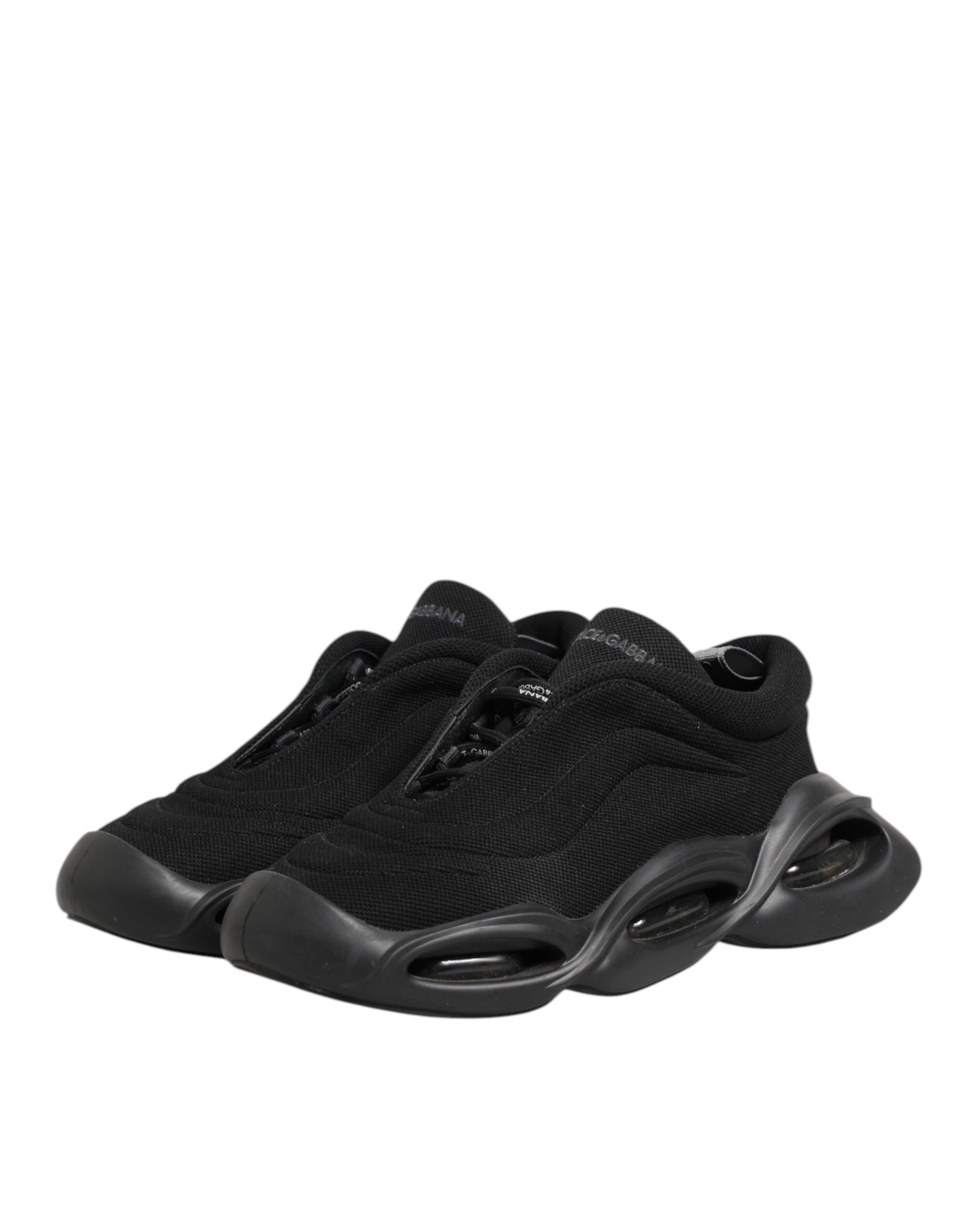 Chaussures sneakers basses Dolce & Gabbana en cuir noir avec lacets, motif ondulé, pour homme, vue de face.