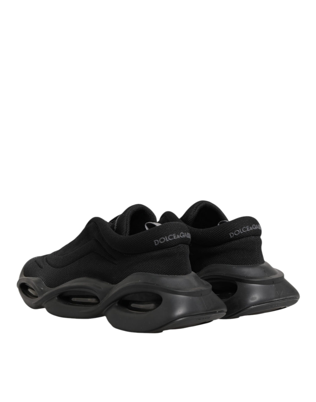 Chaussures sneakers basses pour homme Dolce & Gabbana, lacets noirs, design en vague, style élégant et décontracté.