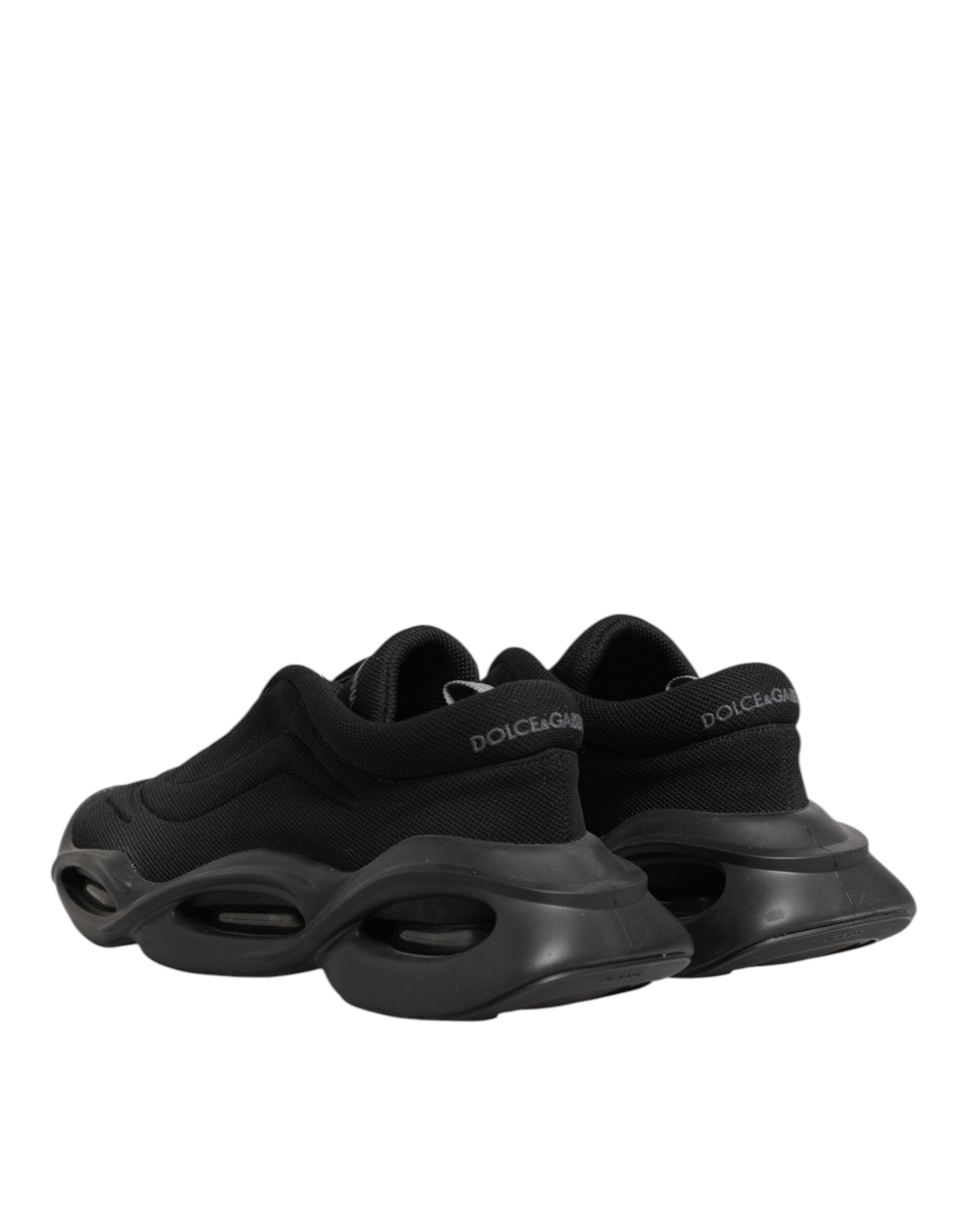 Chaussures sneakers basses pour homme Dolce & Gabbana, lacets noirs, design en vague, style élégant et décontracté.