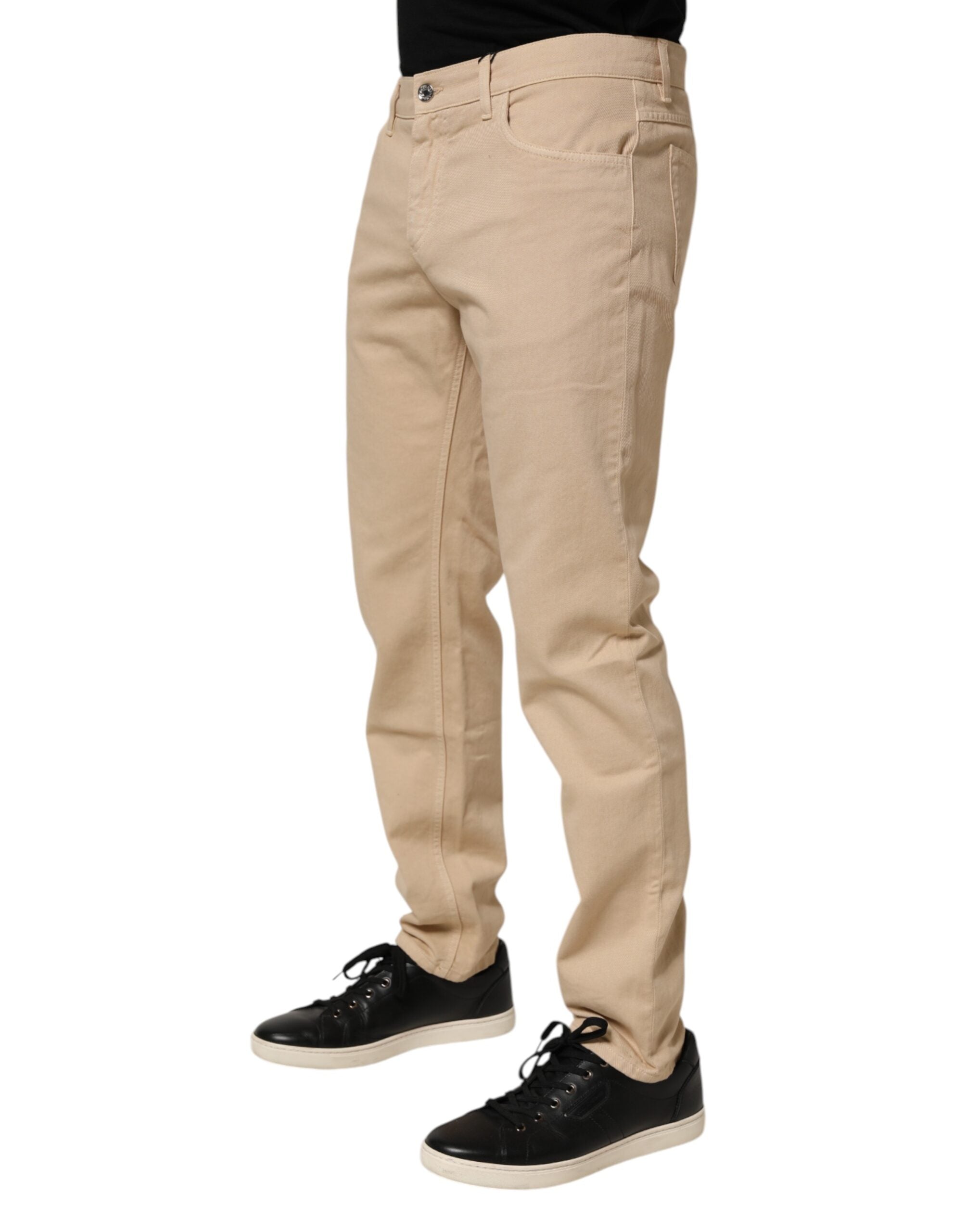Jeans homme Dolce & Gabbana en coton beige skinny réguliers, coupe ajustée et denim de haute qualité.