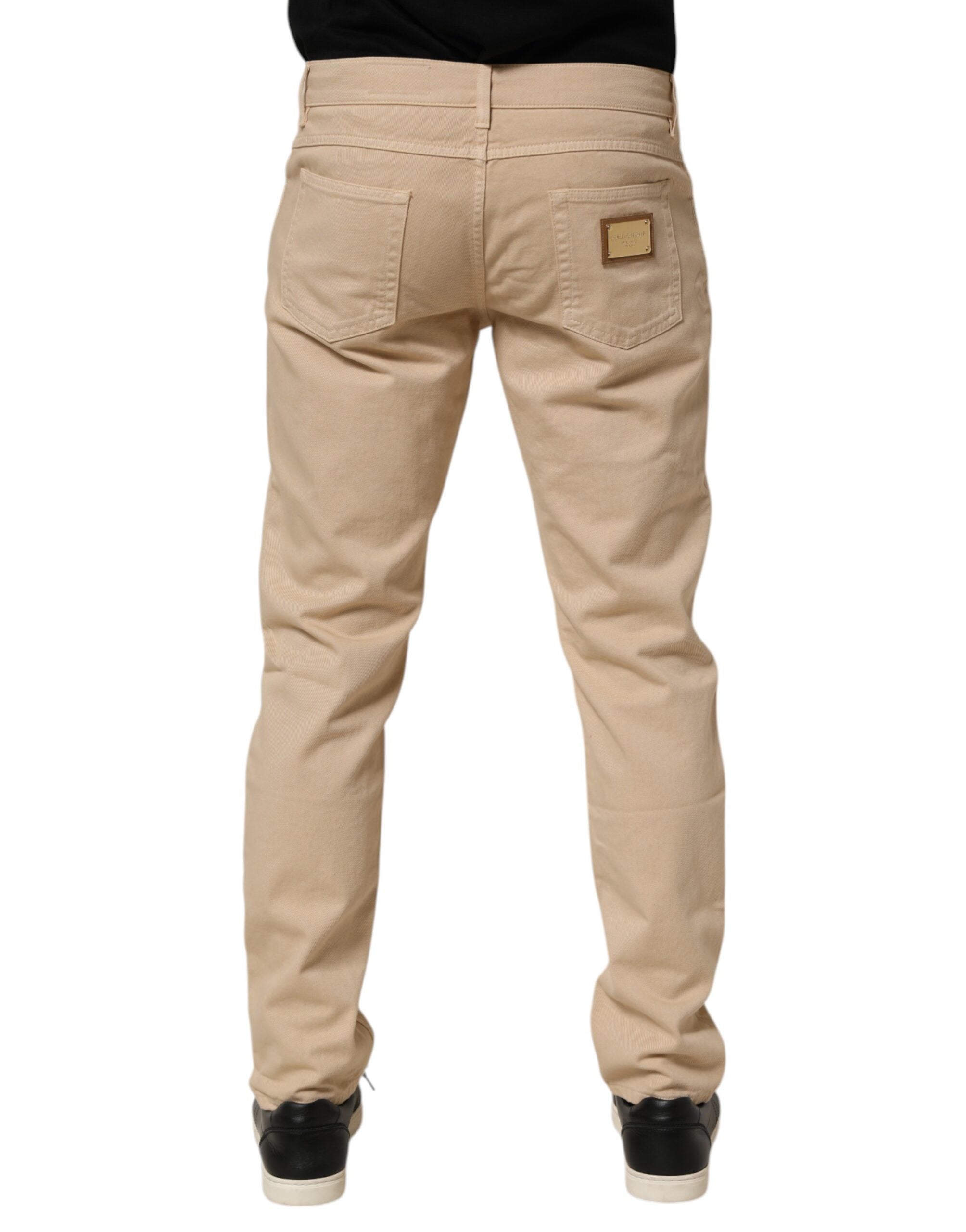 Jeans hommes en denim beige Dolce & Gabbana, coupe skinny et régulière, en coton, vue de face.