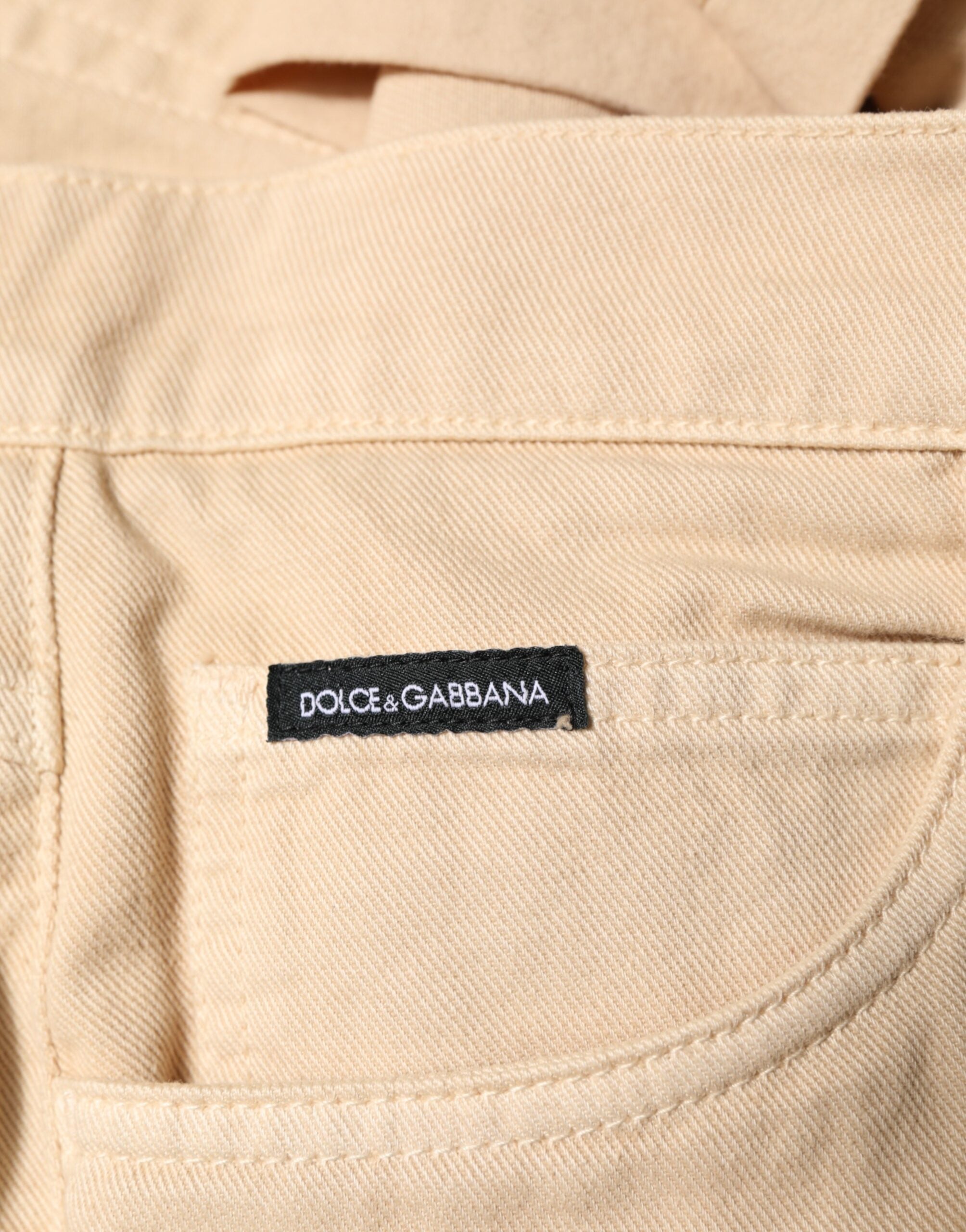 Jeans slim en coton beige de Dolce & Gabbana pour homme, coupe régulière et ajustée, denim de haute qualité.