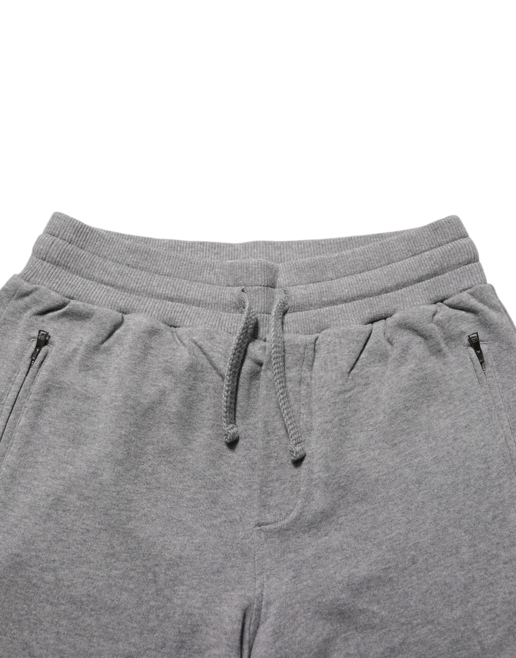 Pantalon de jogging en coton gris Dolce & Gabbana, style décontracté et confortable, avec ceinture élastique et poches latérales.