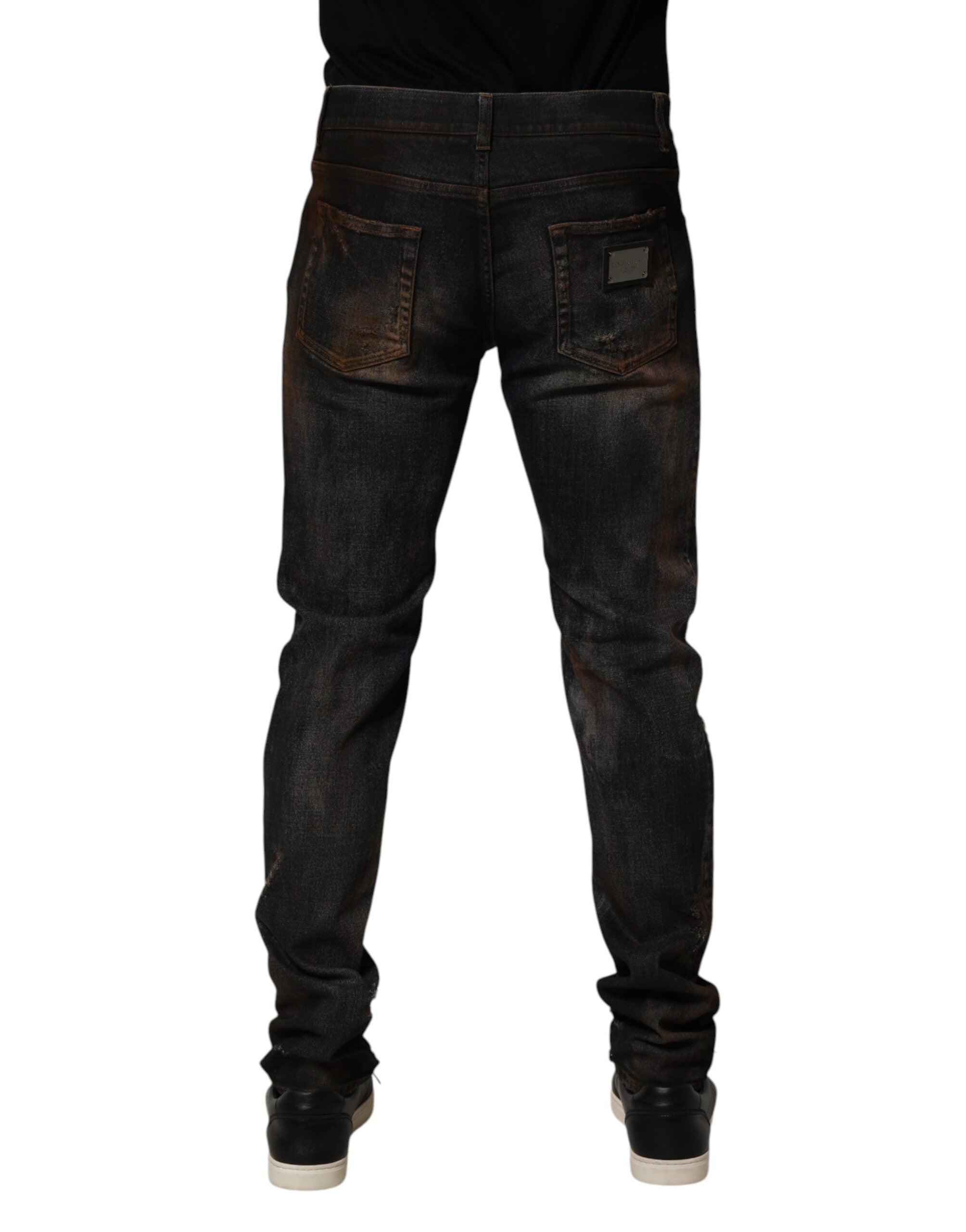 Jeans en denim noir skinny tressés pour homme de Dolce & Gabbana, coton avec déchirures et style décontracté.