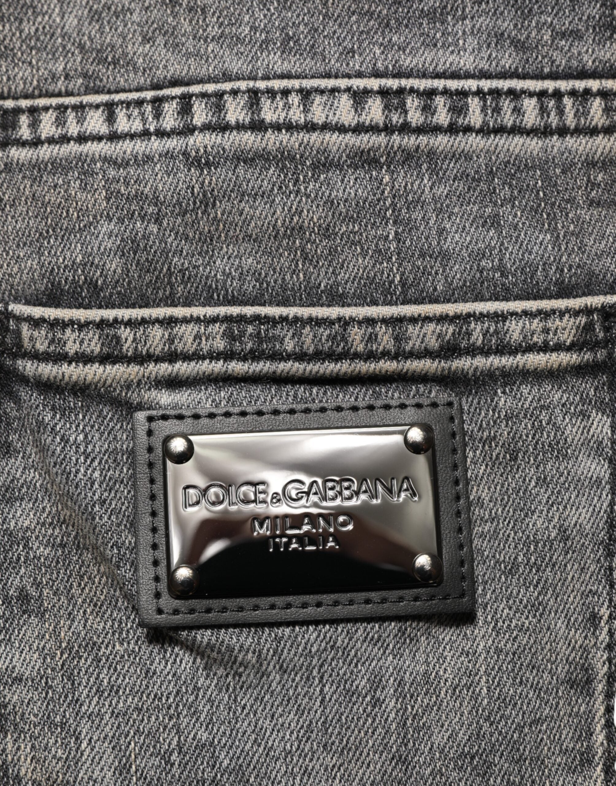 Jeans slim en coton stretch gris de Dolce & Gabbana pour homme, coupe ajustée et détails classiques en denim.