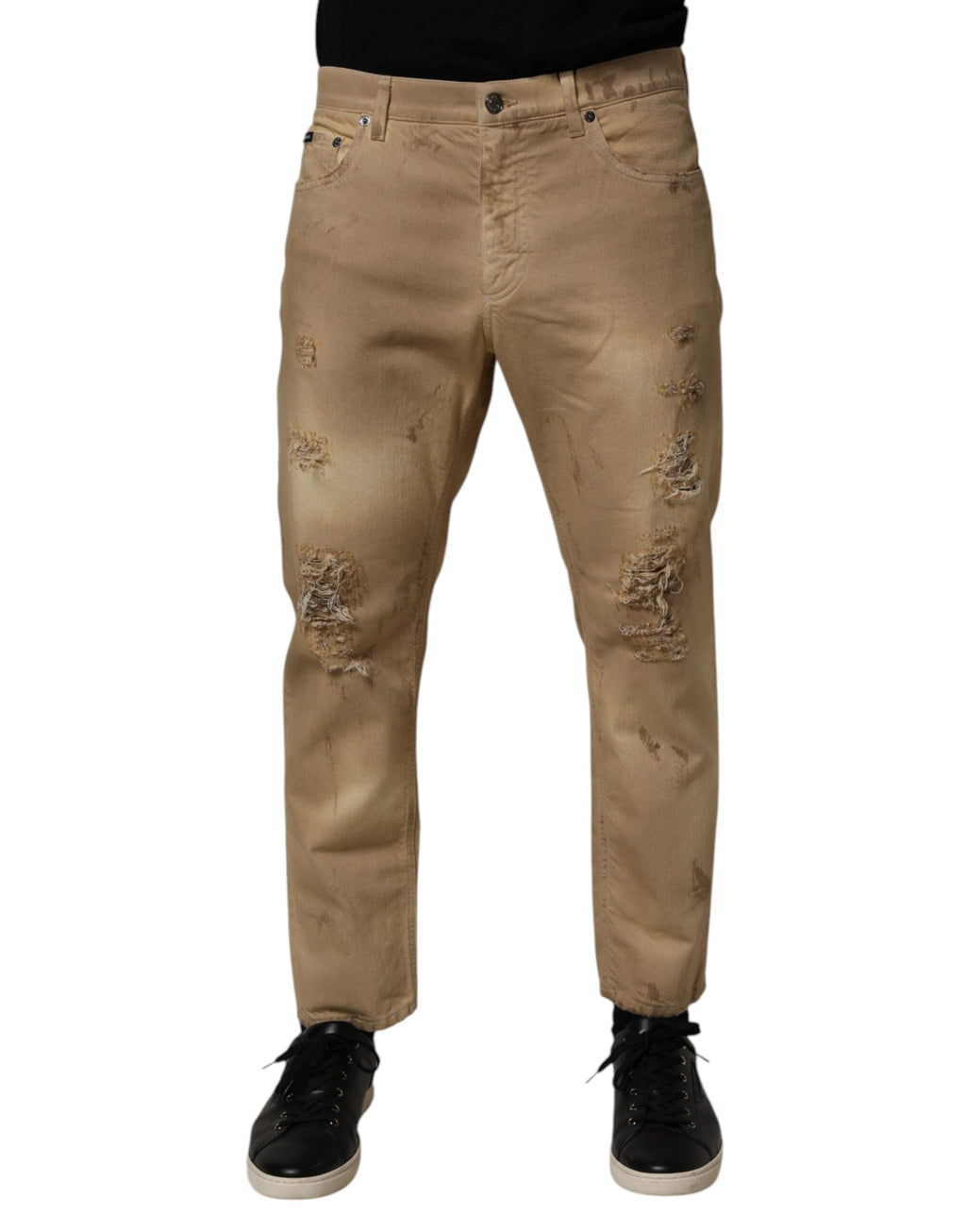 Jeans hommes Dolce & Gabbana en coton beige décontracté avec déchirures et style loose, visible en détail sur l’image.