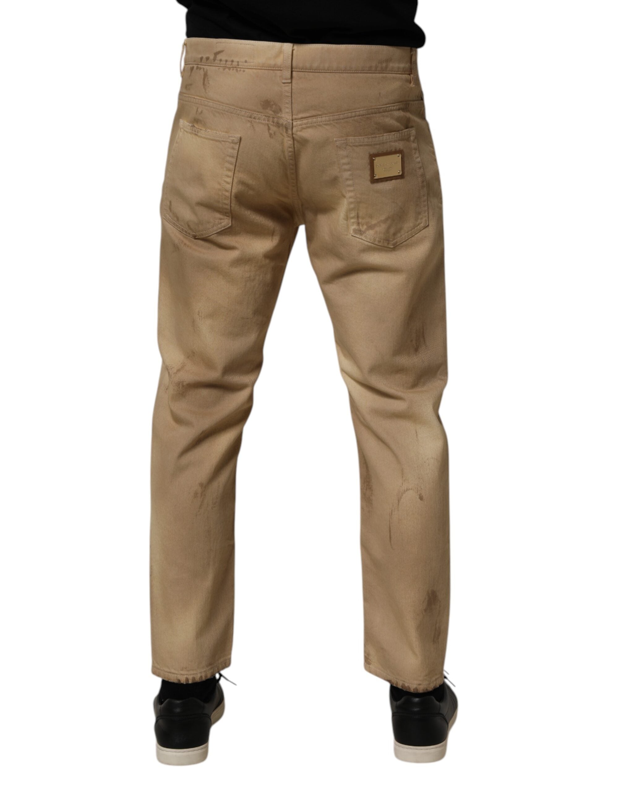 Jeans pour homme en coton beige de Dolce & Gabbana, déchirés et amples, style décontracté et tendance.