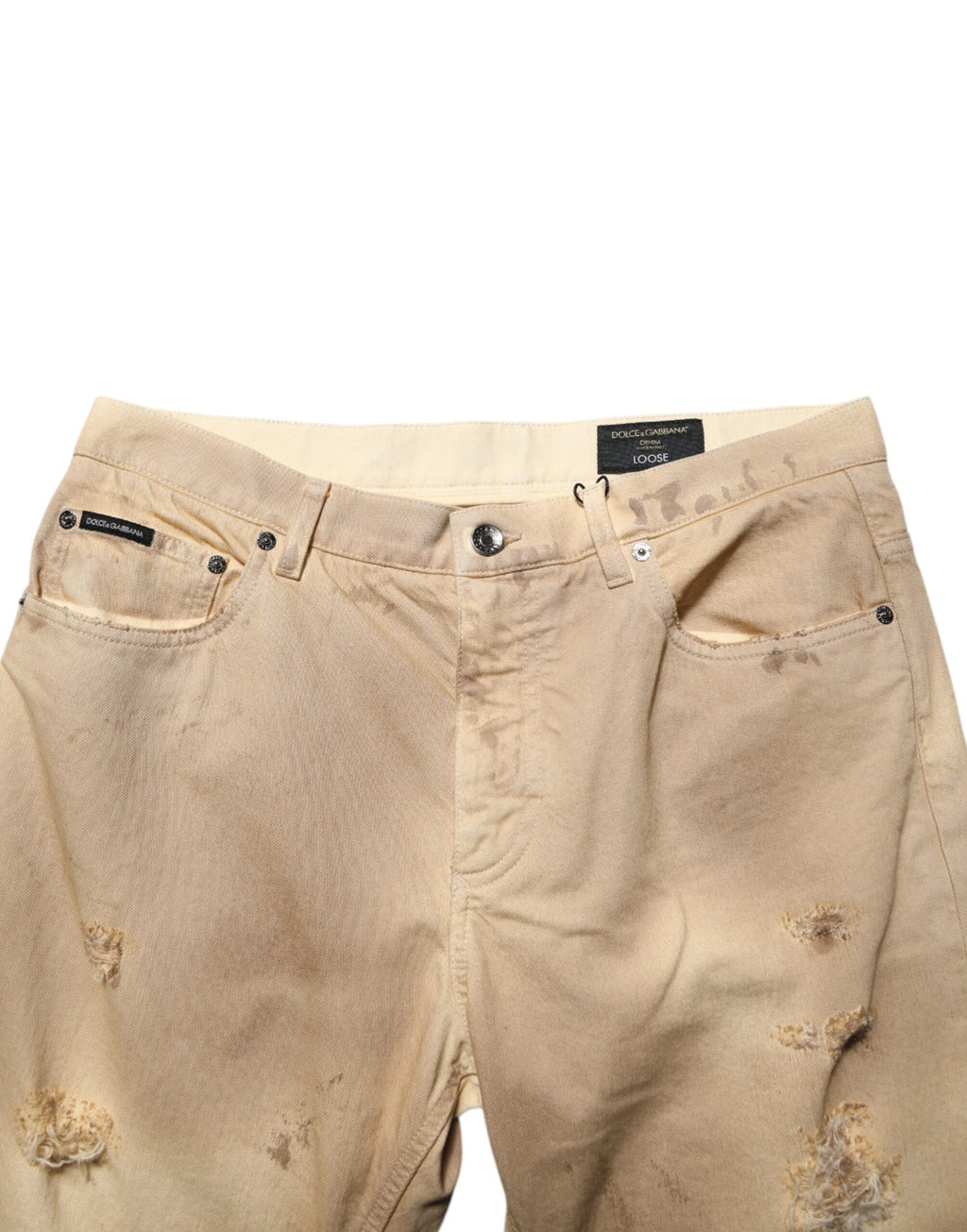 Jeans homme en coton beige déchiré de Dolce & Gabbana, coupe ample et style décontracté, denim tattered.