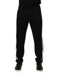 Pantalon jogging en coton noir de Dolce & Gabbana, style décontracté avec élastiques à la taille et aux poignets, tissu doux.