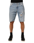 Shorts Bermuda en denim déchiré en coton bleu Dolce & Gabbana, style décontracté et tendance.