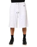 Shorts bermuda en coton blanc de Dolce & Gabbana avec déchirures, style décontracté et tendance.