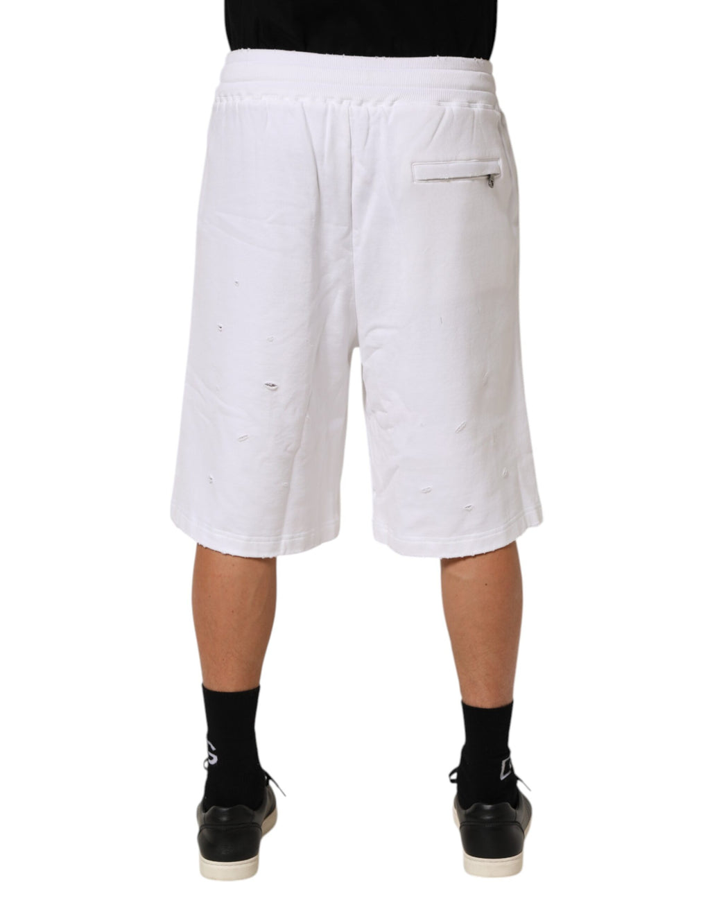 Shorts bermuda en coton blanc de Dolce & Gabbana avec déchirures, style décontracté et tendance.
