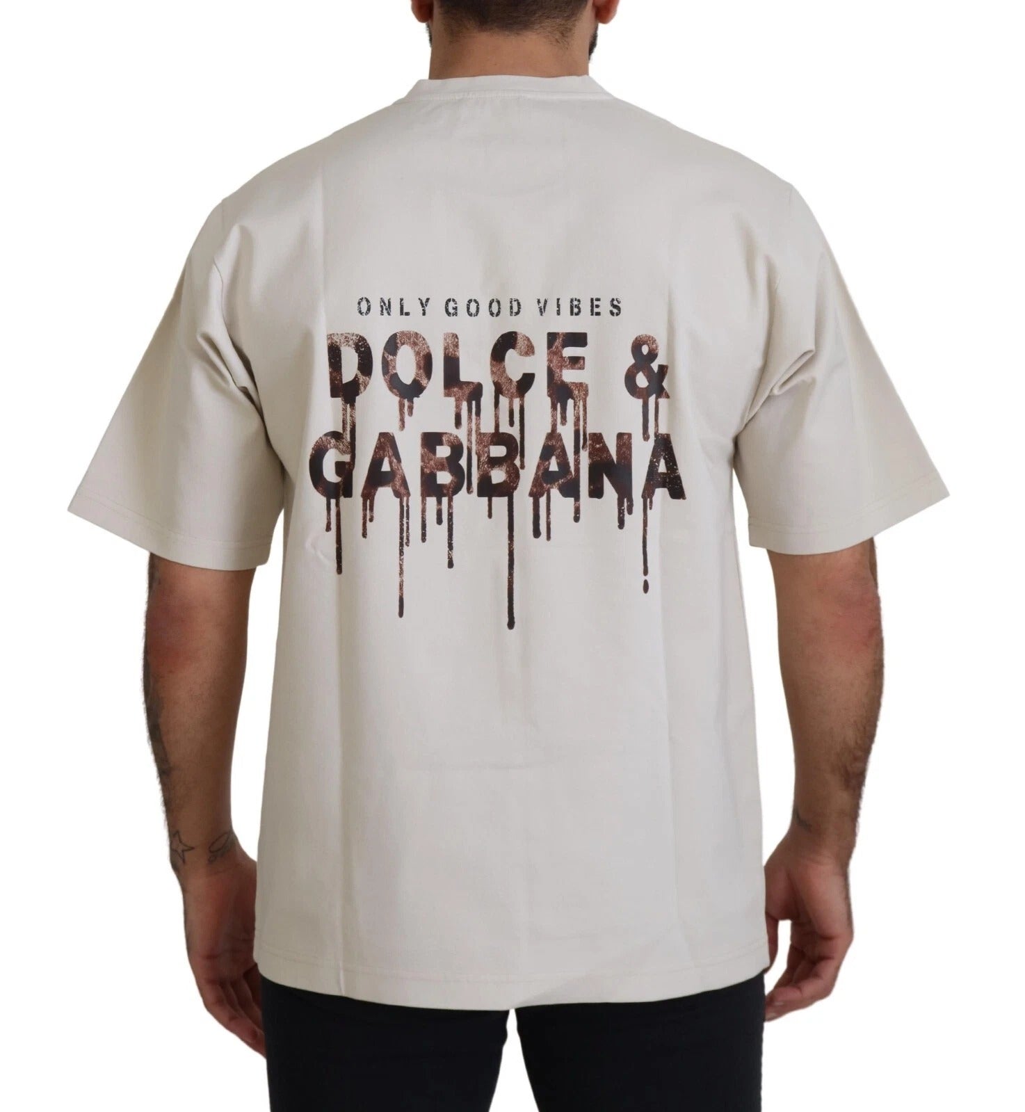 Pull en coton ivoire Dolce & Gabbana à col rond avec imprimé élégant, visible en image.