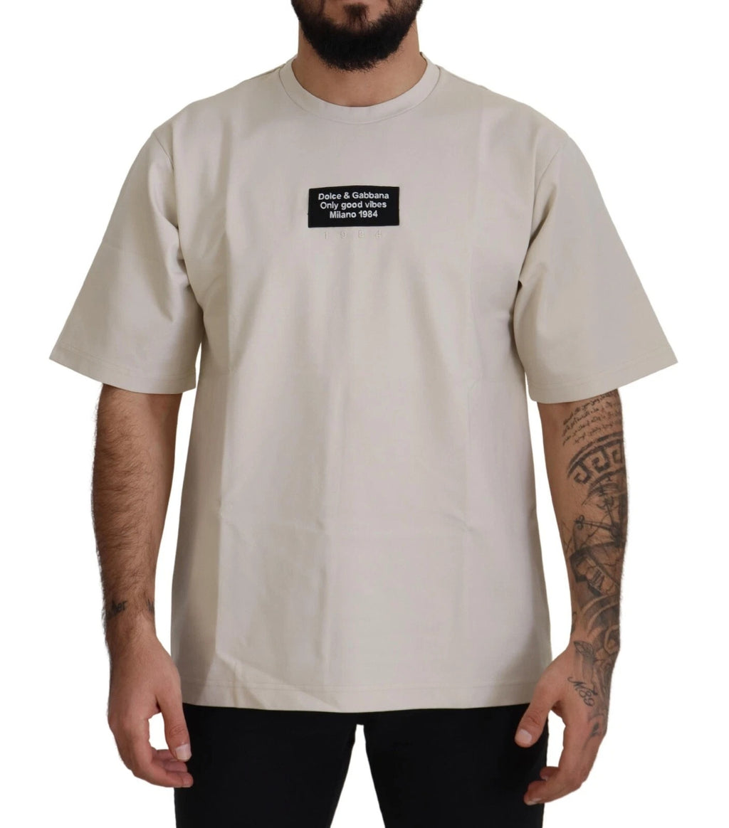 Pull blanc en coton imprimé avec col rond Dolce & Gabbana, vue de face, style décontracté et élégant.